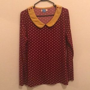 Red and mustard colored long-sleeve blouse